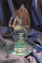 The Roland Wagner Award, a sculpture that looks like a flame, made out of glass