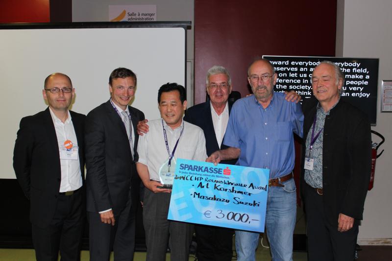 Art Karshmer and Masakazu Suzuki  holding an award 